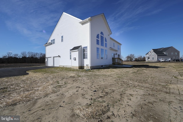 view of side of property featuring a garage