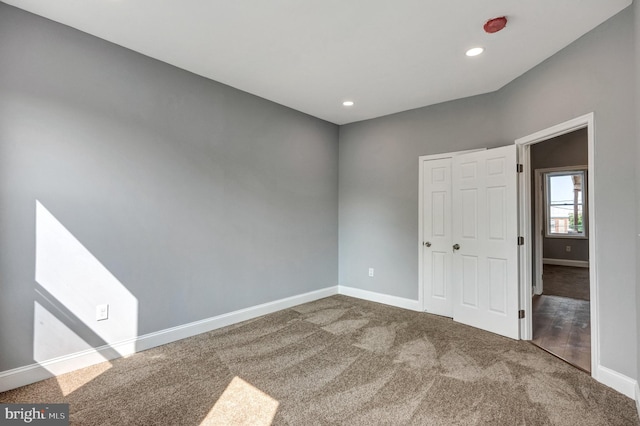 spare room featuring carpet flooring