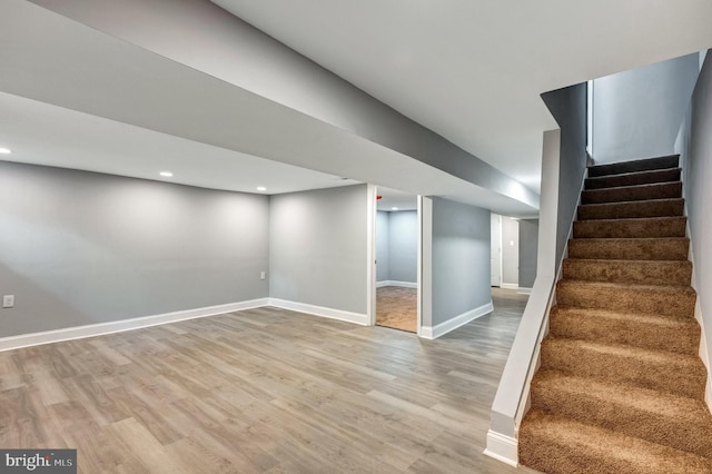 basement featuring wood-type flooring