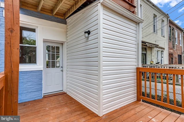 property entrance with a wooden deck