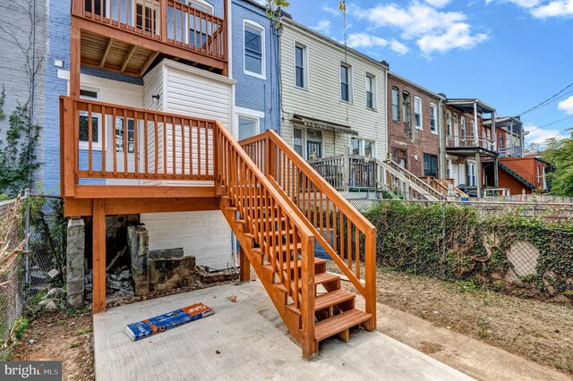 back of house with a patio area and a deck