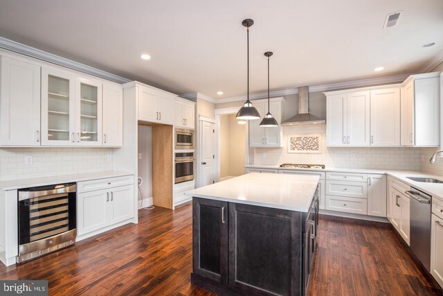 kitchen featuring backsplash, wine cooler, wall chimney exhaust hood, dark hardwood / wood-style floors, and stainless steel appliances