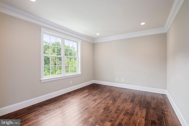 unfurnished room with baseboards, dark wood-style flooring, and ornamental molding