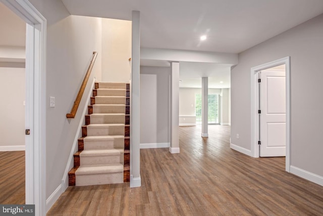 stairway featuring hardwood / wood-style flooring