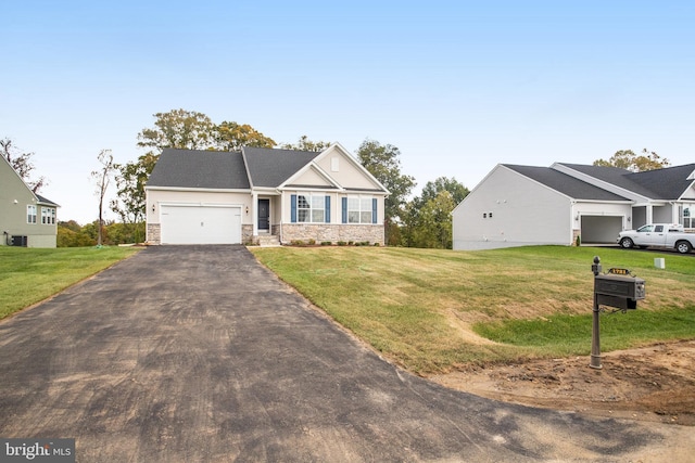 view of front of house with a garage, stone siding, aphalt driveway, and a front lawn