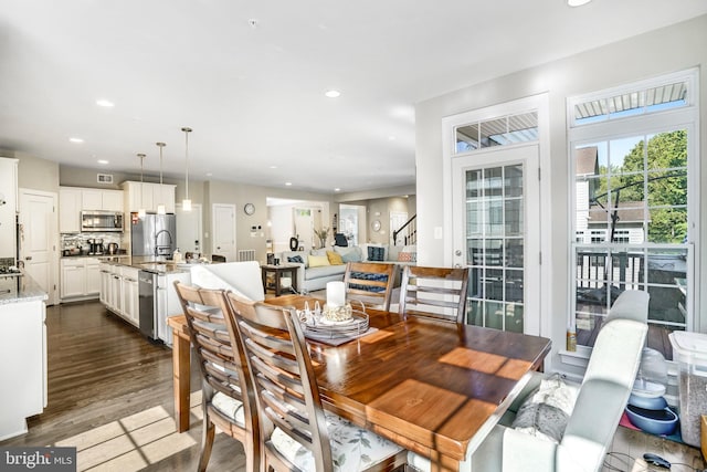 dining room featuring dark hardwood / wood-style floors and sink