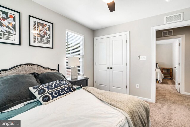 carpeted bedroom with ceiling fan