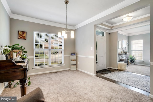 interior space featuring a chandelier and crown molding