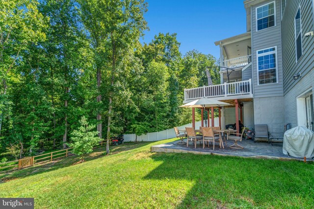 view of yard featuring a deck and a patio area