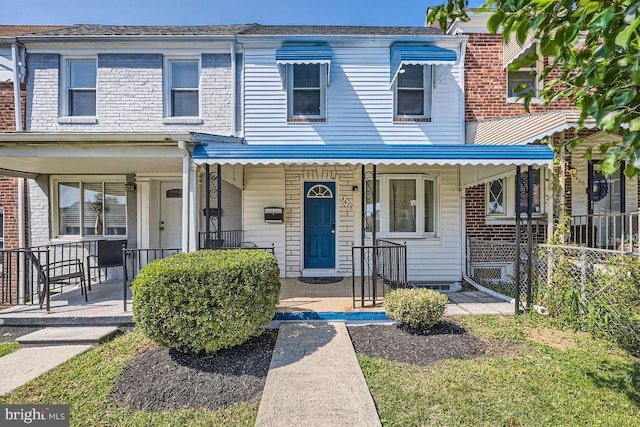 view of property with covered porch