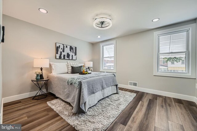 bedroom featuring dark wood-type flooring