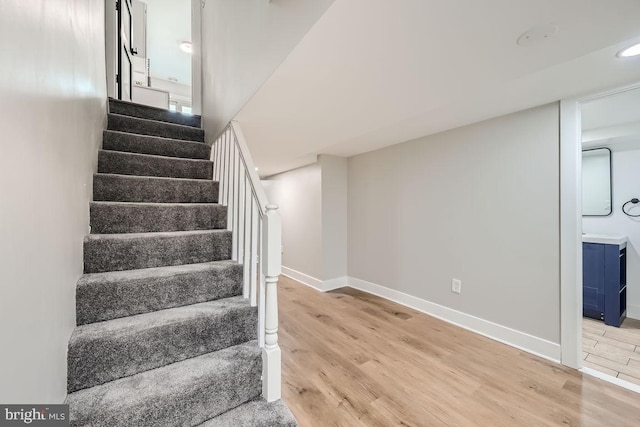 stairway with wood-type flooring