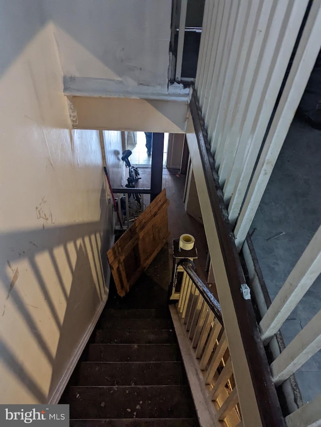 stairway featuring hardwood / wood-style flooring