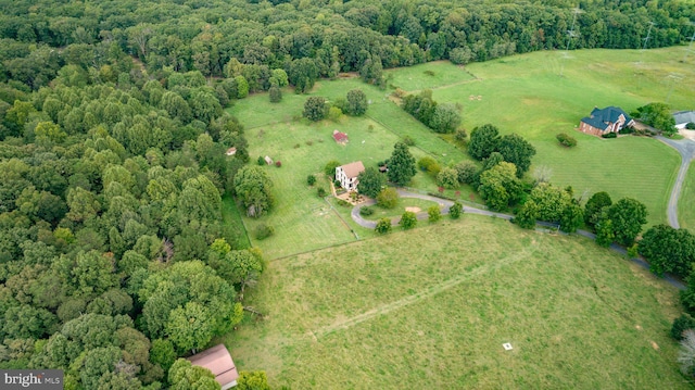 drone / aerial view with a rural view and a wooded view