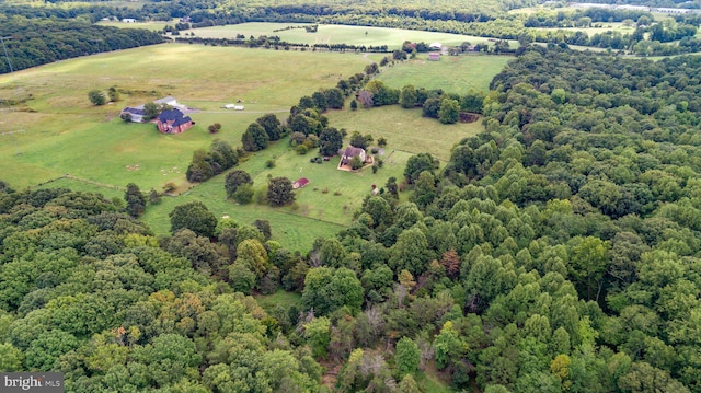 birds eye view of property with a rural view