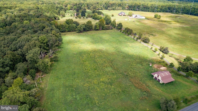 birds eye view of property featuring a rural view