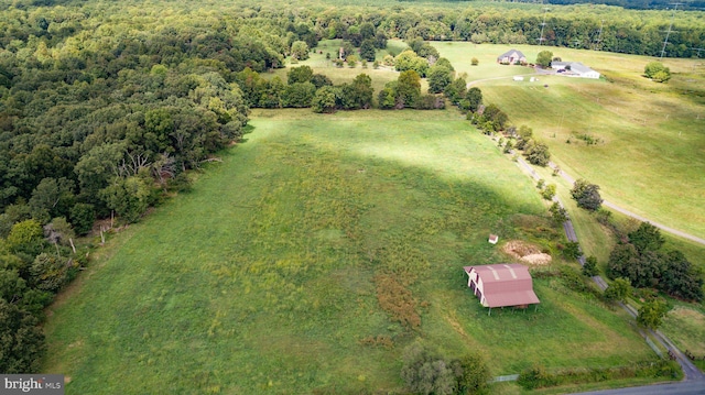 birds eye view of property with a rural view and a forest view