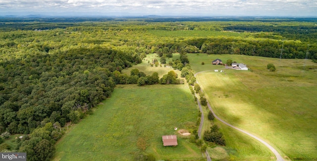 bird's eye view with a rural view and a view of trees