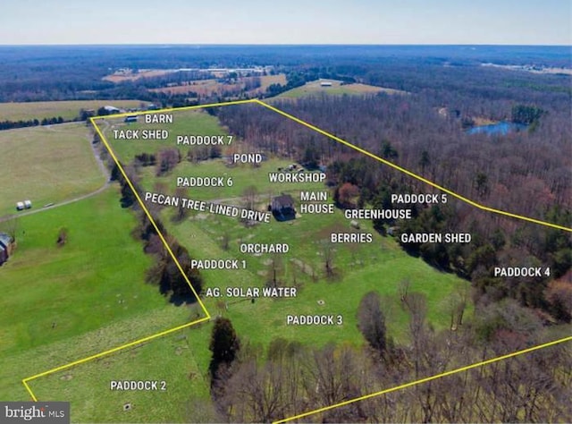 birds eye view of property featuring a rural view