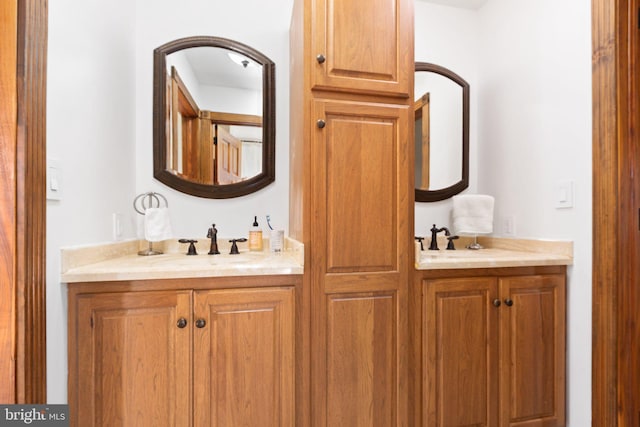 bathroom with double vanity and a sink