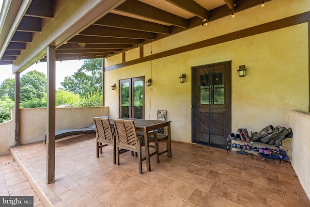 view of patio with french doors and outdoor dining area