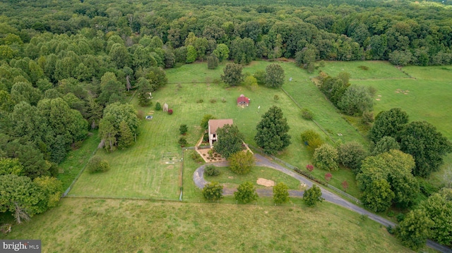 drone / aerial view with a rural view and a view of trees