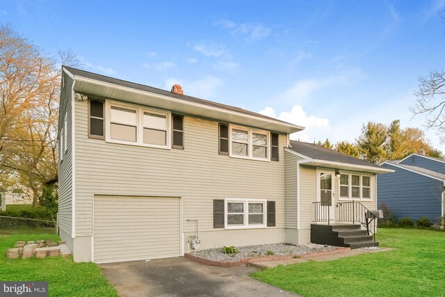 exterior space featuring a garage and a front yard