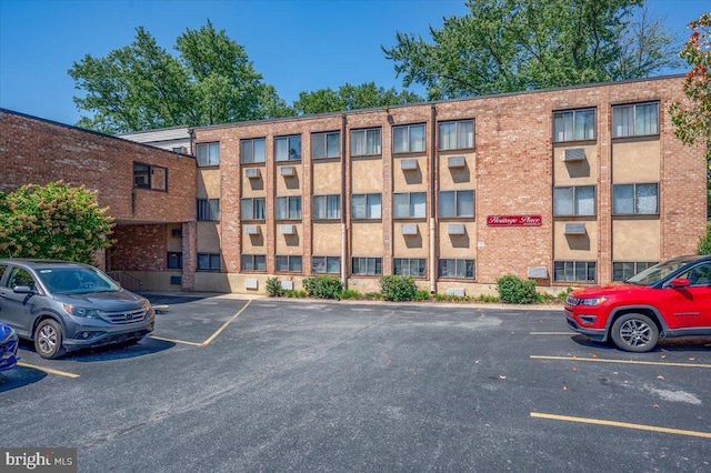 view of property with uncovered parking