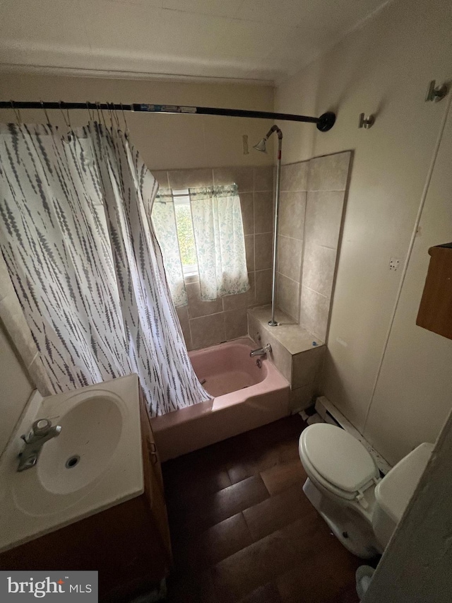 bathroom featuring vanity, toilet, and shower / bathtub combination with curtain