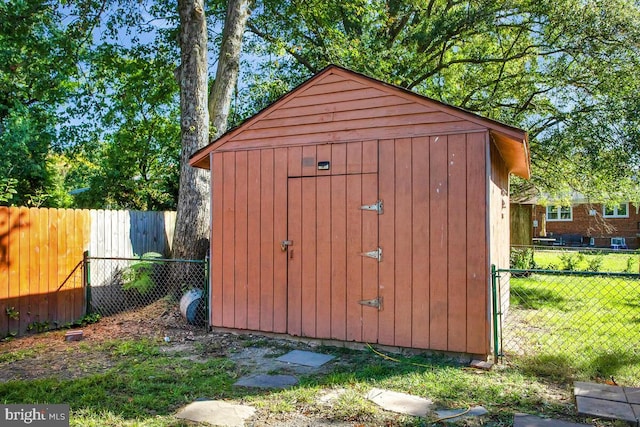 view of outbuilding featuring a lawn