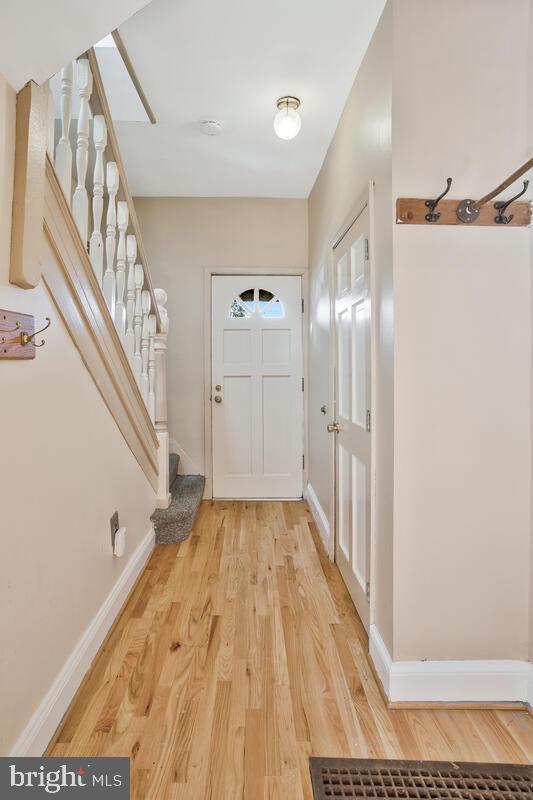 doorway to outside featuring hardwood / wood-style flooring