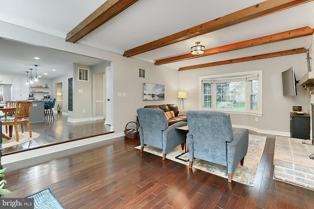 living room with beam ceiling and dark hardwood / wood-style floors