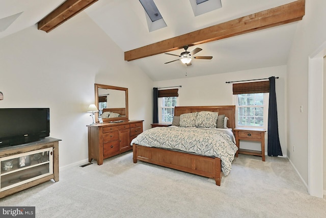 carpeted bedroom with high vaulted ceiling, ceiling fan, and beamed ceiling