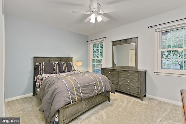 bedroom featuring light carpet and ceiling fan