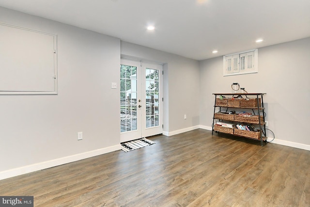 empty room with wood-type flooring and french doors