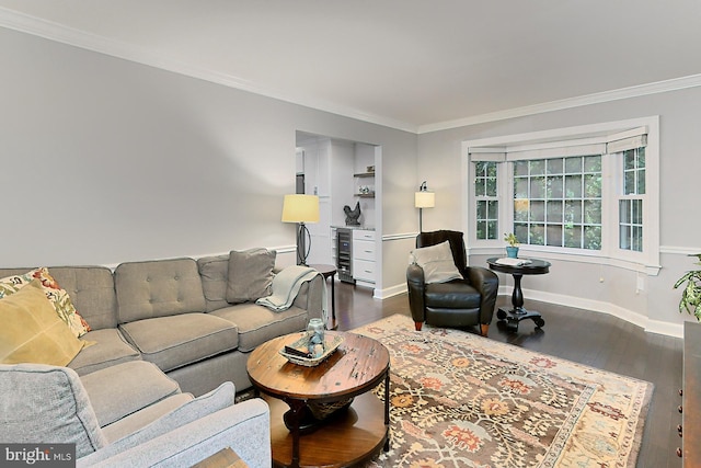 living room with ornamental molding, dark hardwood / wood-style flooring, and beverage cooler