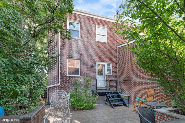 rear view of house featuring a patio area