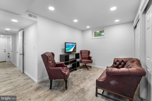 sitting room featuring light wood-type flooring