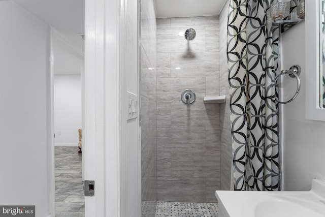 bathroom featuring vanity, walk in shower, and tile patterned flooring