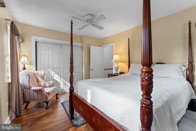 bedroom with ceiling fan, dark hardwood / wood-style floors, and a closet