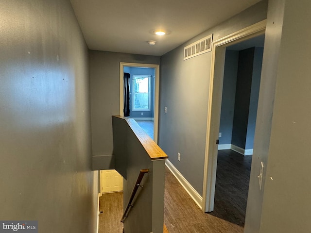 corridor featuring dark hardwood / wood-style floors