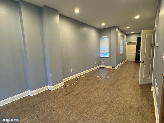 unfurnished room with dark hardwood / wood-style floors