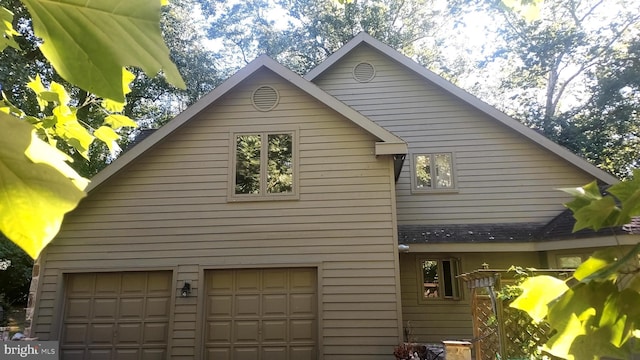 view of side of home with a garage