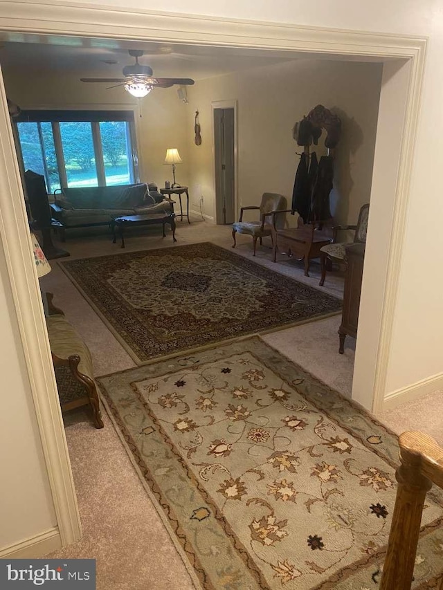 hall with light colored carpet