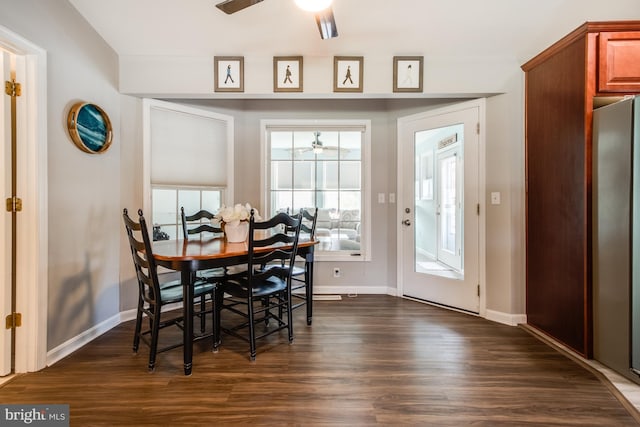 dining area featuring ceiling fan and dark hardwood / wood-style flooring