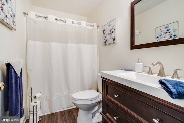 bathroom with vanity, toilet, curtained shower, and wood-type flooring