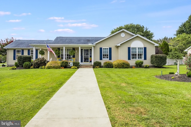 ranch-style home featuring a front yard