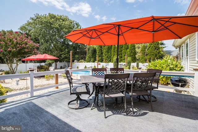 view of patio / terrace featuring a fenced in pool