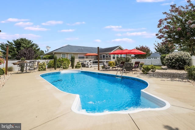 view of swimming pool with a patio