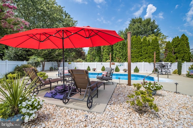 view of patio featuring a fenced in pool